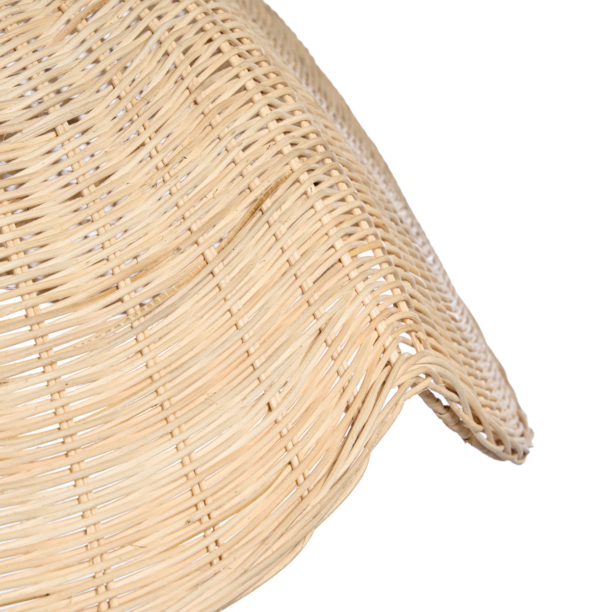 Close up of a woven natural material product on a white background
