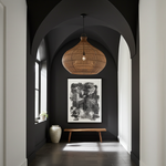 extra large rattan ceiling light Modern interior hallway with dark walls, a wooden bench, and a hanging light fixture.
