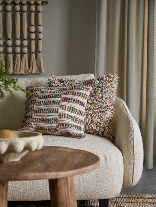 Cotton jute and wood wall hanging in wadis sabi living room