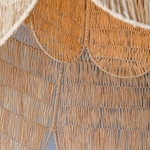 Close-up of arattan chandelier in a domed rounded petal shape