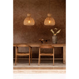 kitchen Dining area with wooden  table, chairs, and rattan pendant lights against a brown wall.