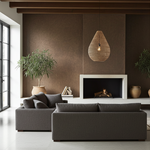 Modern living room with a gray sofa, fireplace, and large rattan light shade
