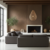Modern living room with a gray sofa, fireplace, and large rattan light shade