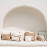boho rustic neutral cushions on a day bed with rattan wall lights