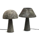 Two concrete mushroom-shaped lamps on a white background