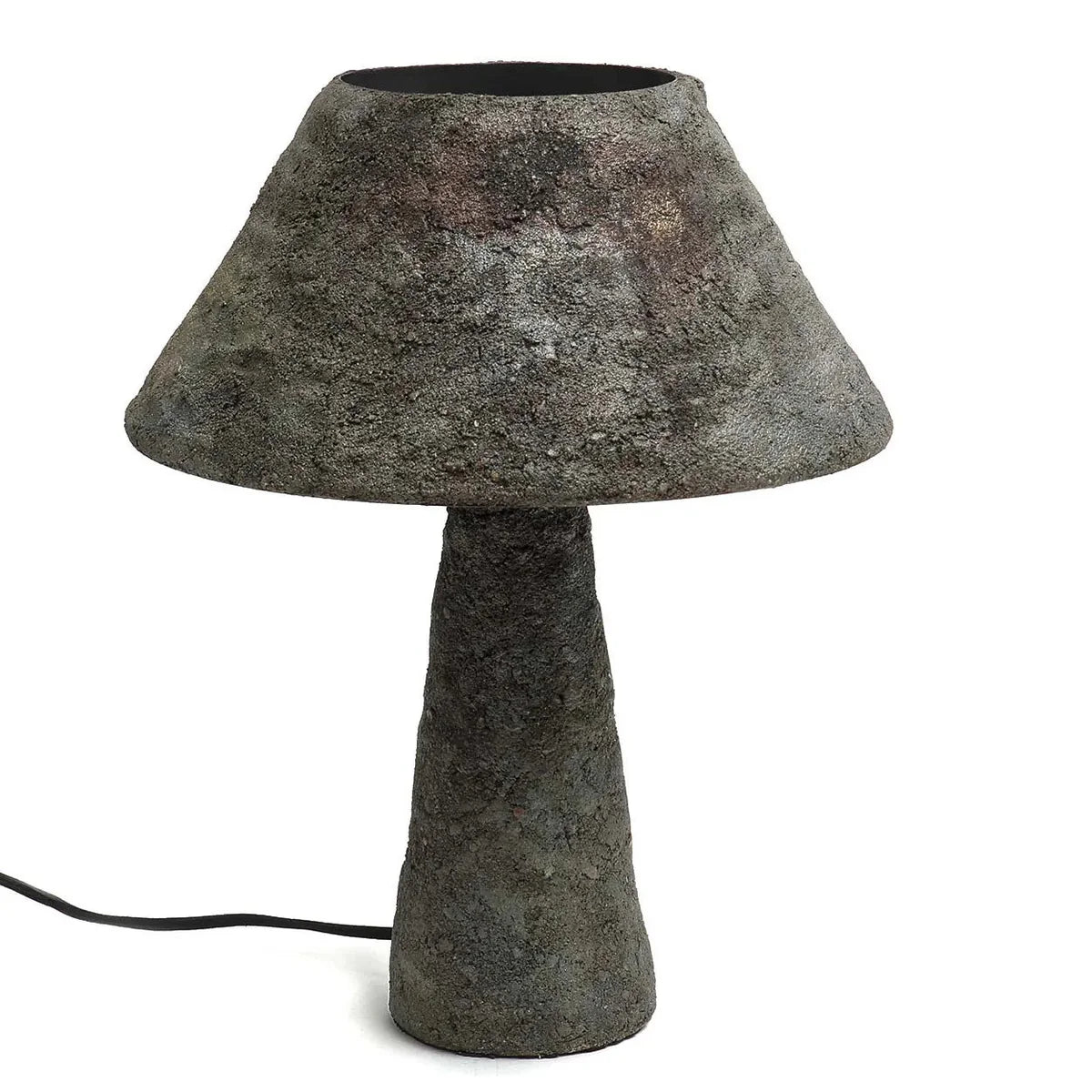 Cement table lamp with a textured design on a white background