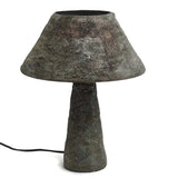 Cement table lamp with a textured design on a white background
