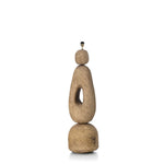 Rustic stone floor lamp with a unique design on a white background
