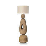 Floor standard lamp with a textured base and linen shade on a white background