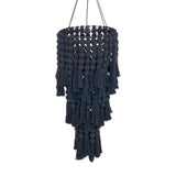 Black macramé chandelier with tassels on a white background